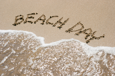 "beach day" written into the sand