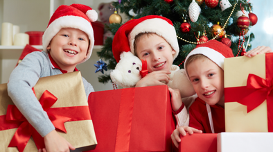 3 boys with Christmas gifts