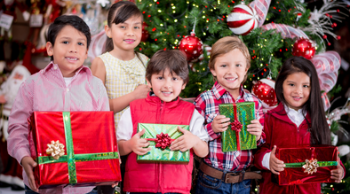 Kids holding Christmas presents