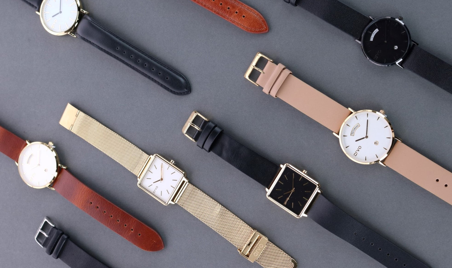 Many different style watches laid out