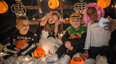 four kids wearing costumes