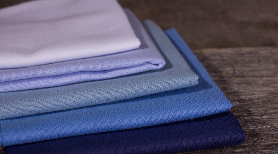 A stack of handkerchiefs laying on wood