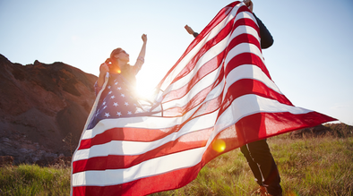 Couple standing with American flag