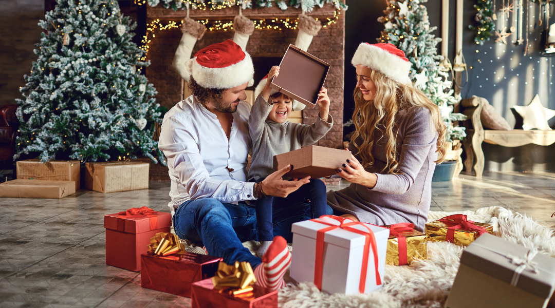 Parents giving their child a christmas gift