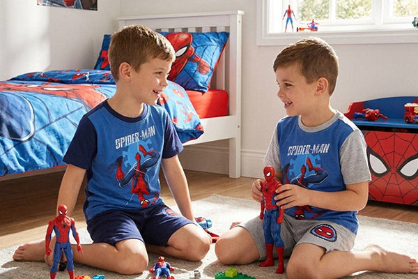 Kids wearing spiderman pajamas 